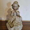 Poupée vintage en Porcelaine