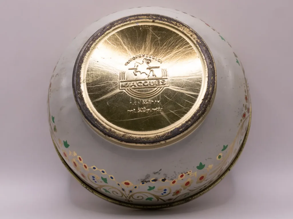 Boîte en métal ronde vintage Superchocolat Jacques dorée blanche